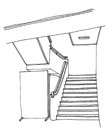 エレベーターホールの横にある階段を1階から見た様子
